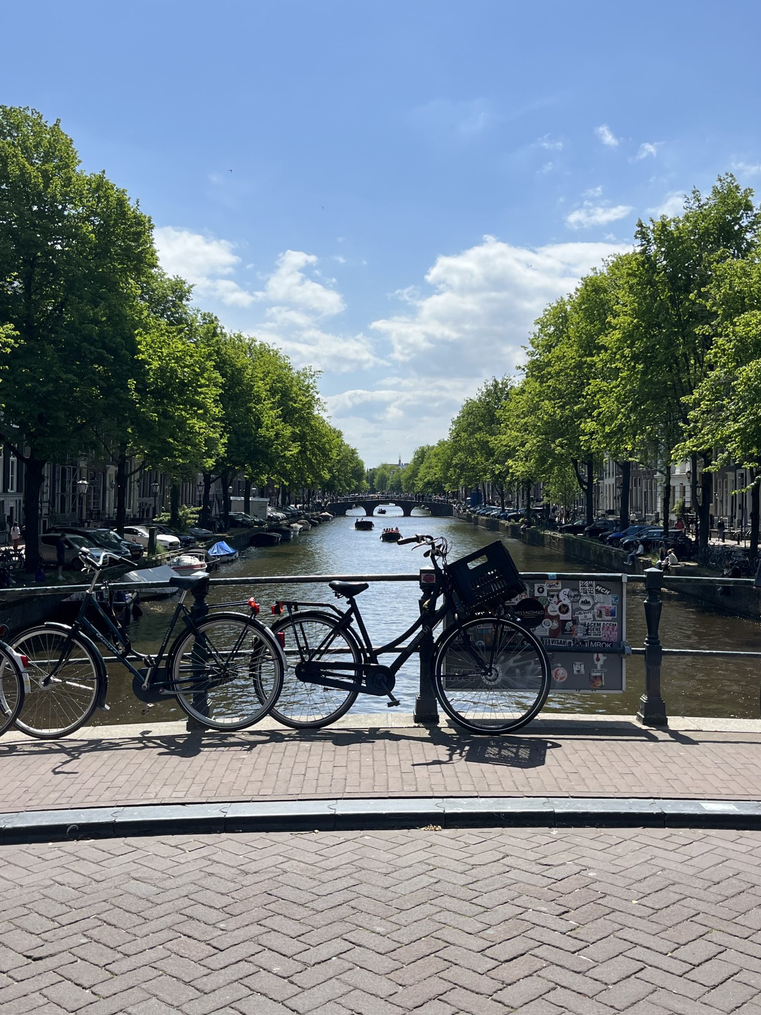 Cycle Amsterdam canal blue sky postcard from travel bicycle cobbled street green peaceful