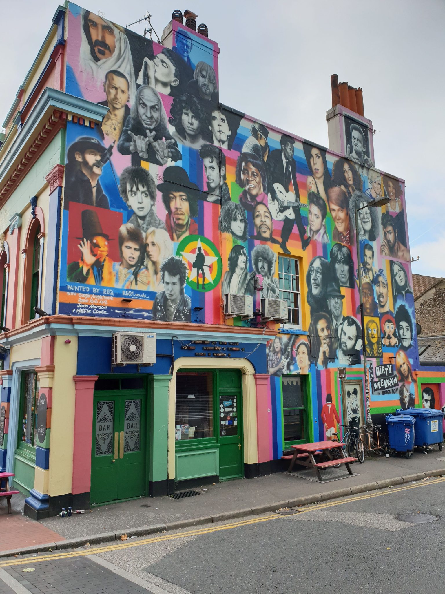 While wandering downtown Brighton for WordCamp Brighton 2018 - I photographed this house which wall has tens of paintings of famous people.