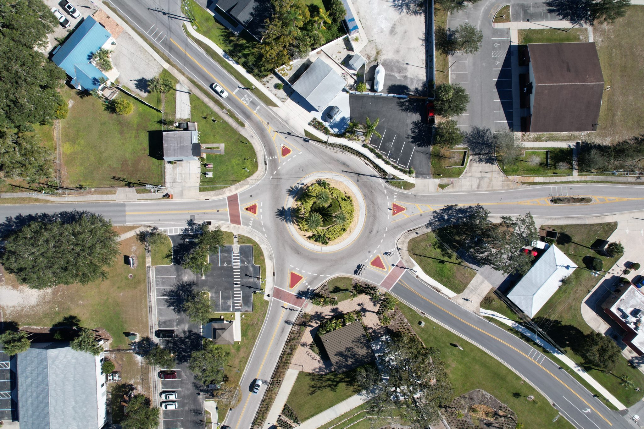 Aerial view of a five-way roundabout in a small downtown area
