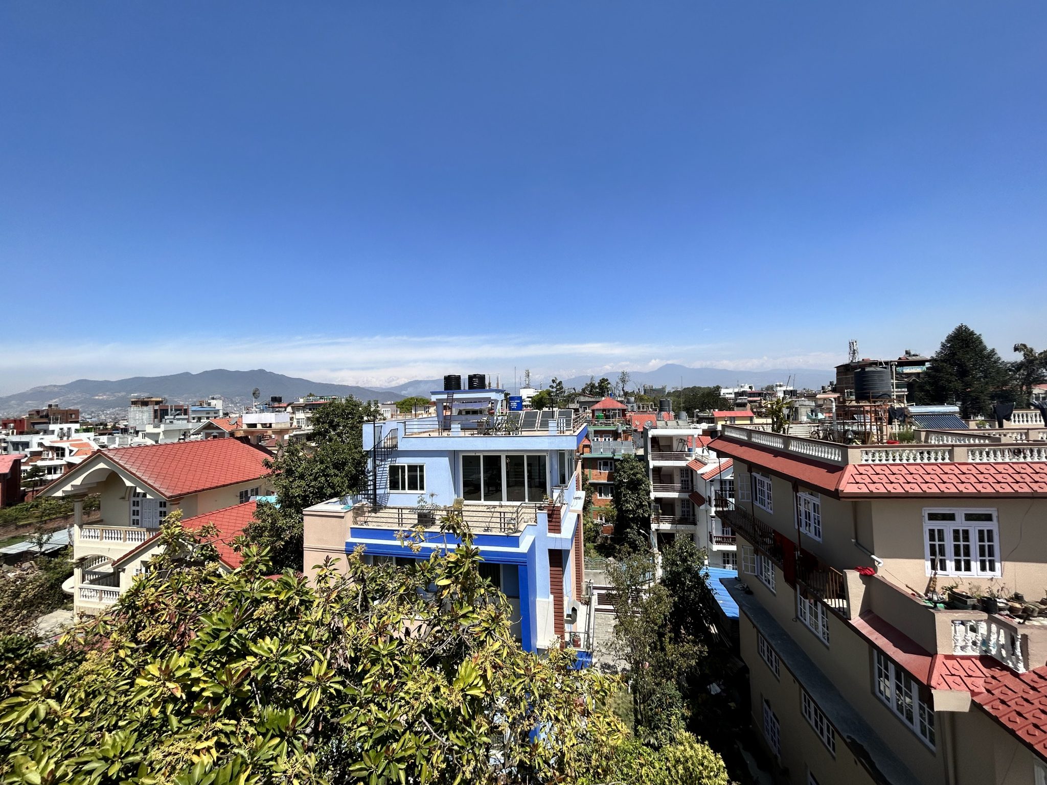 Scenic Skype view of lush Lalitpur City and verdant hills
