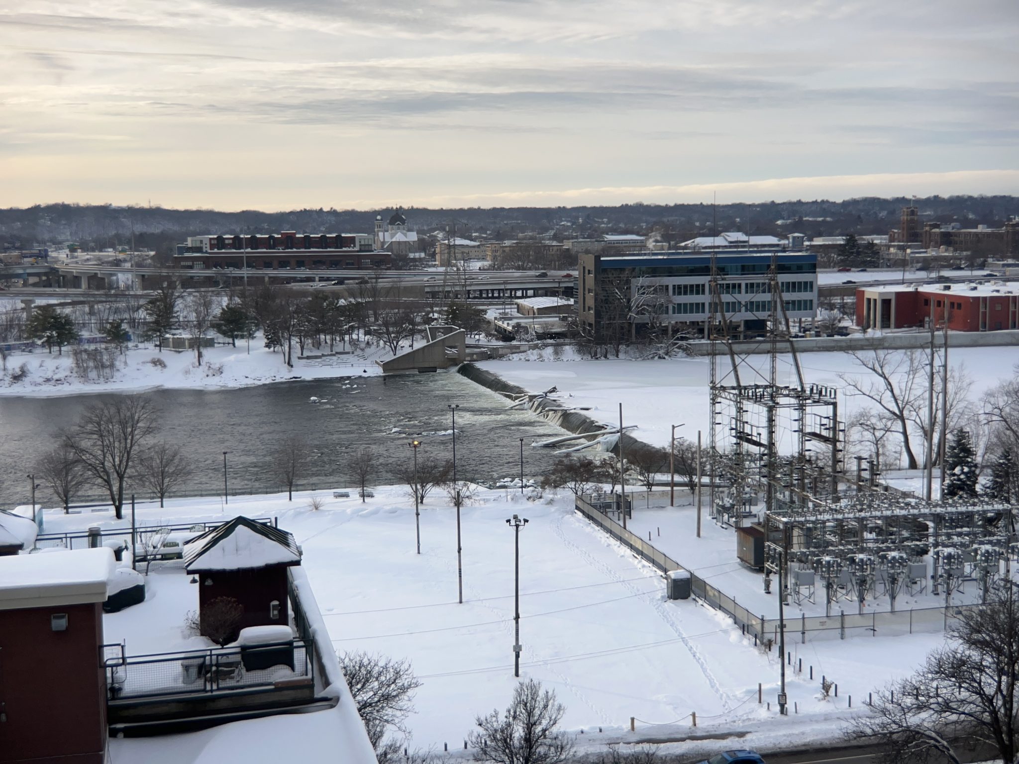 Snowy morning in Grand Rapids, Michigan, looking over the Grand River at the Fish Ladder