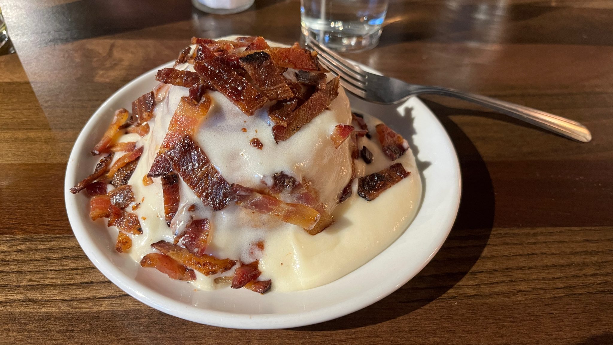 Bacon and frosting on a cinnamon roll