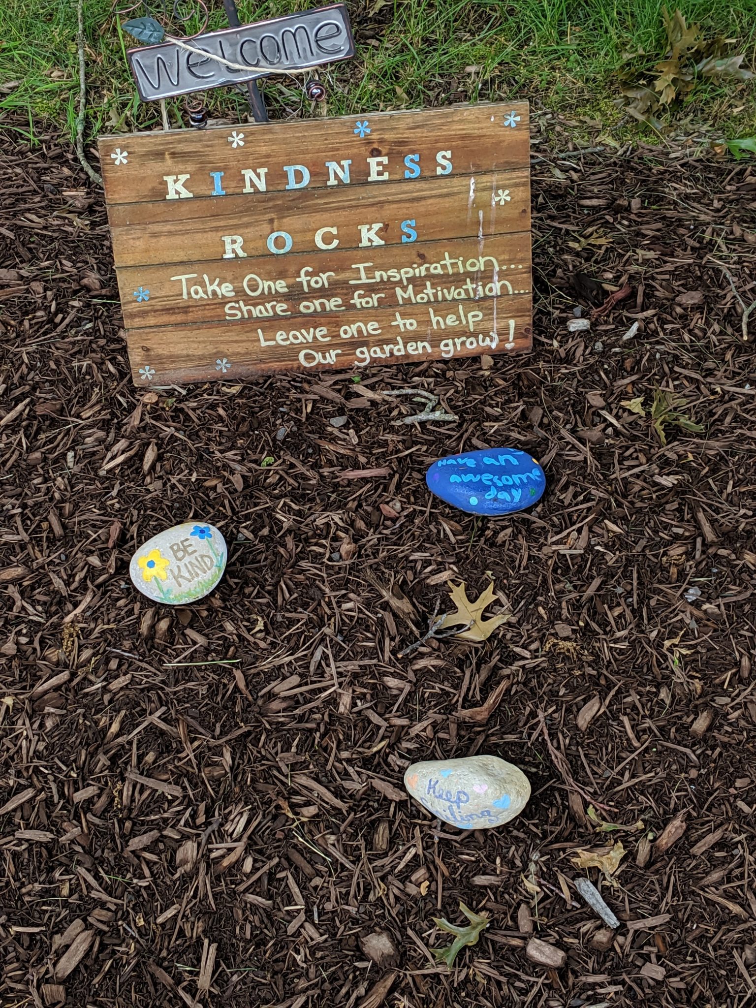 Kindness rocks, blue and yellow, motivation, inspiration, public sidewalk.