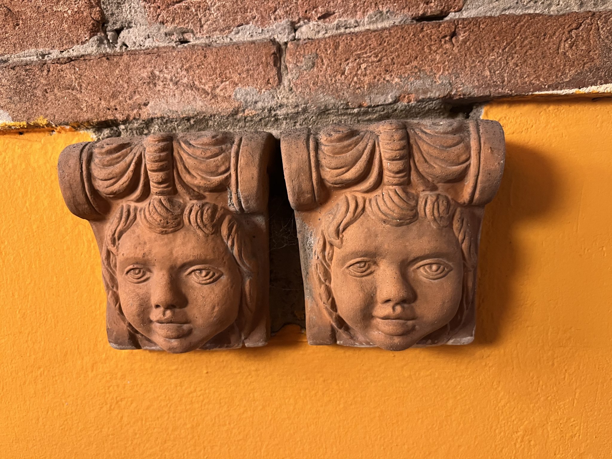 Decorative clay cherubs