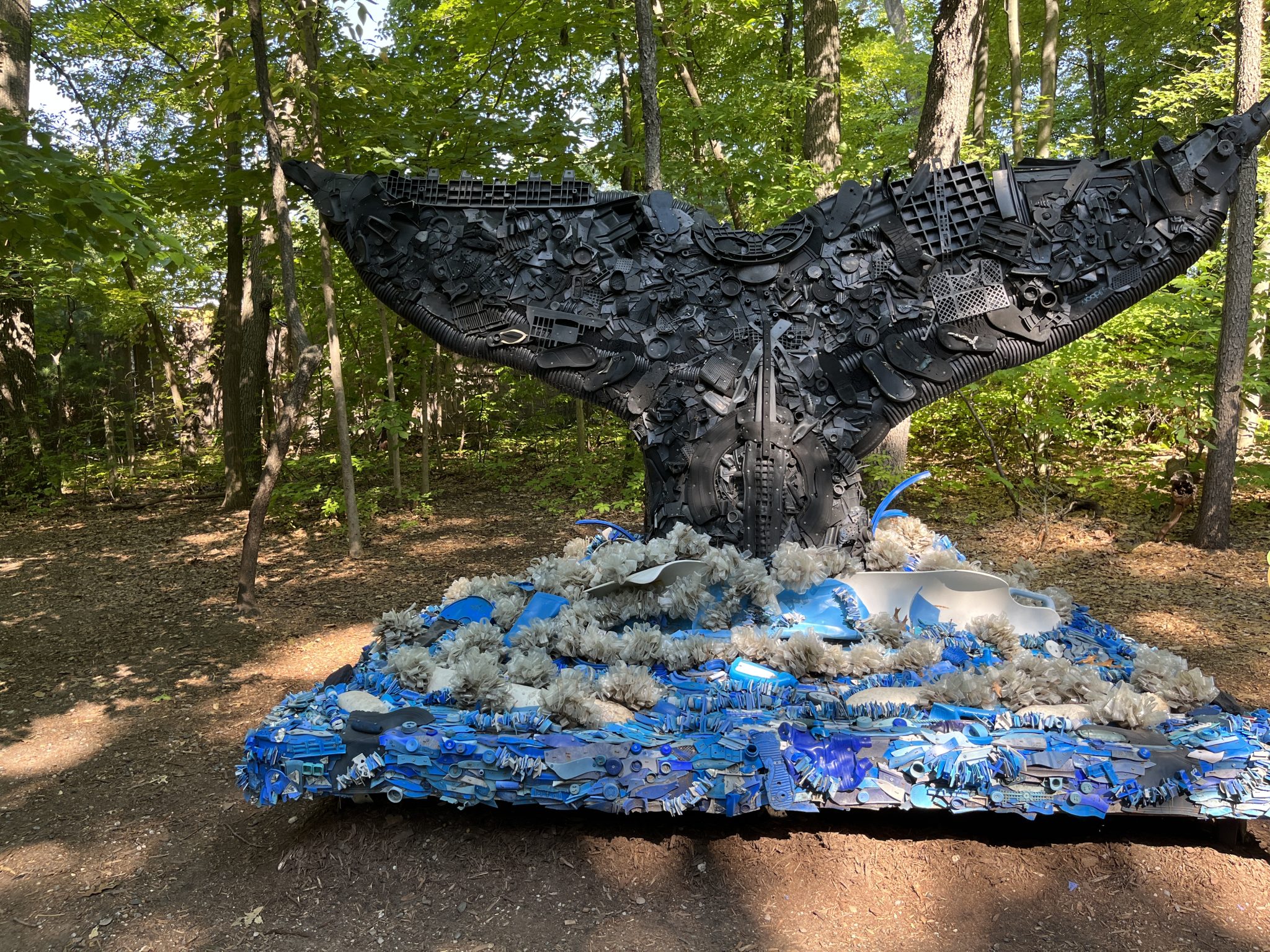 Whale tail made entirely from trash.