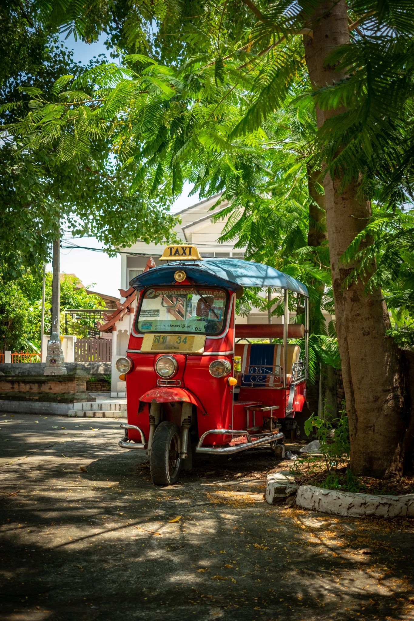Tuk-tuk in a temple courtyard, Chiang Mai, Thailand