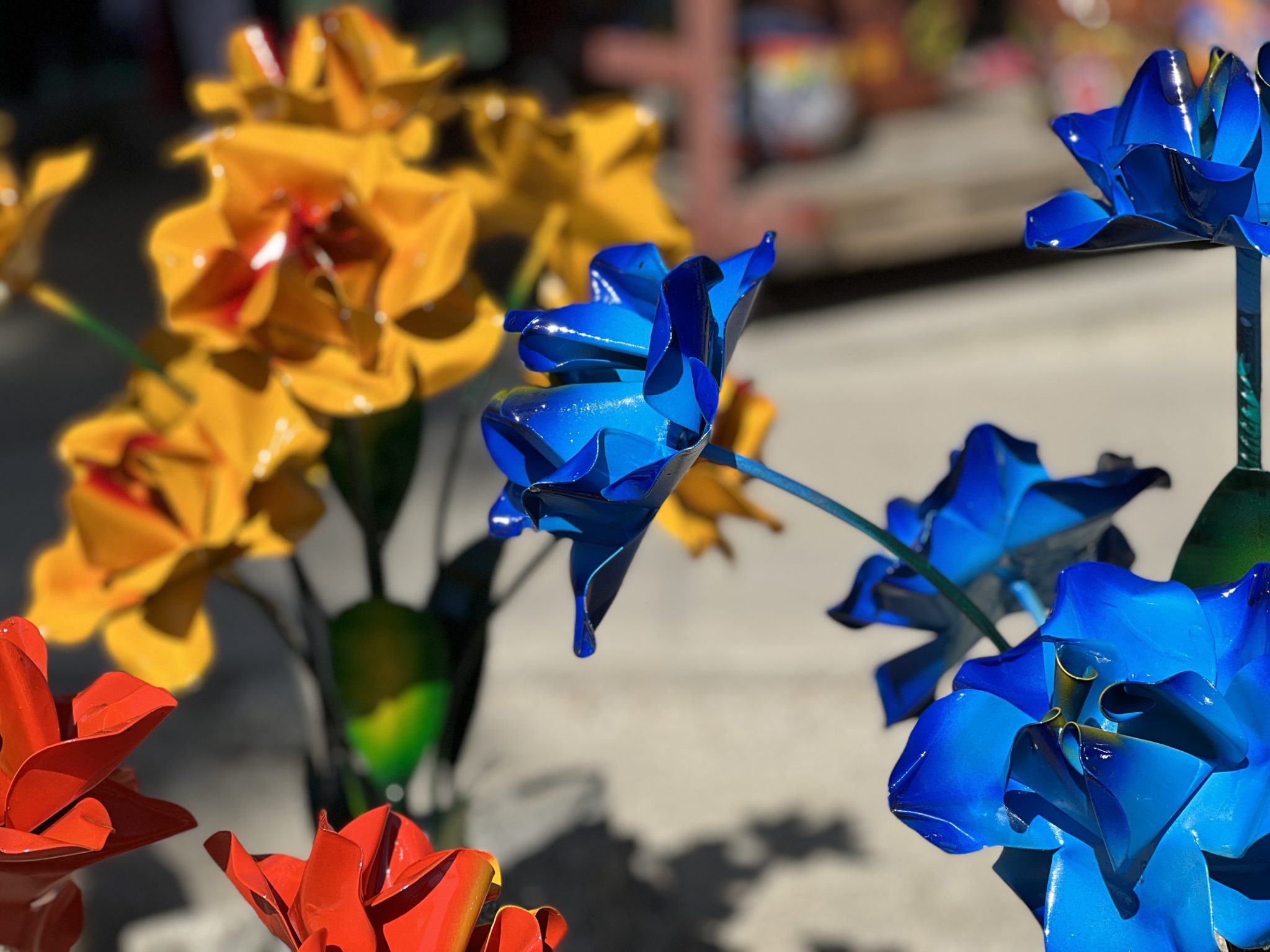 Colorful Metal Flowers in Yellow, Red, and Blue