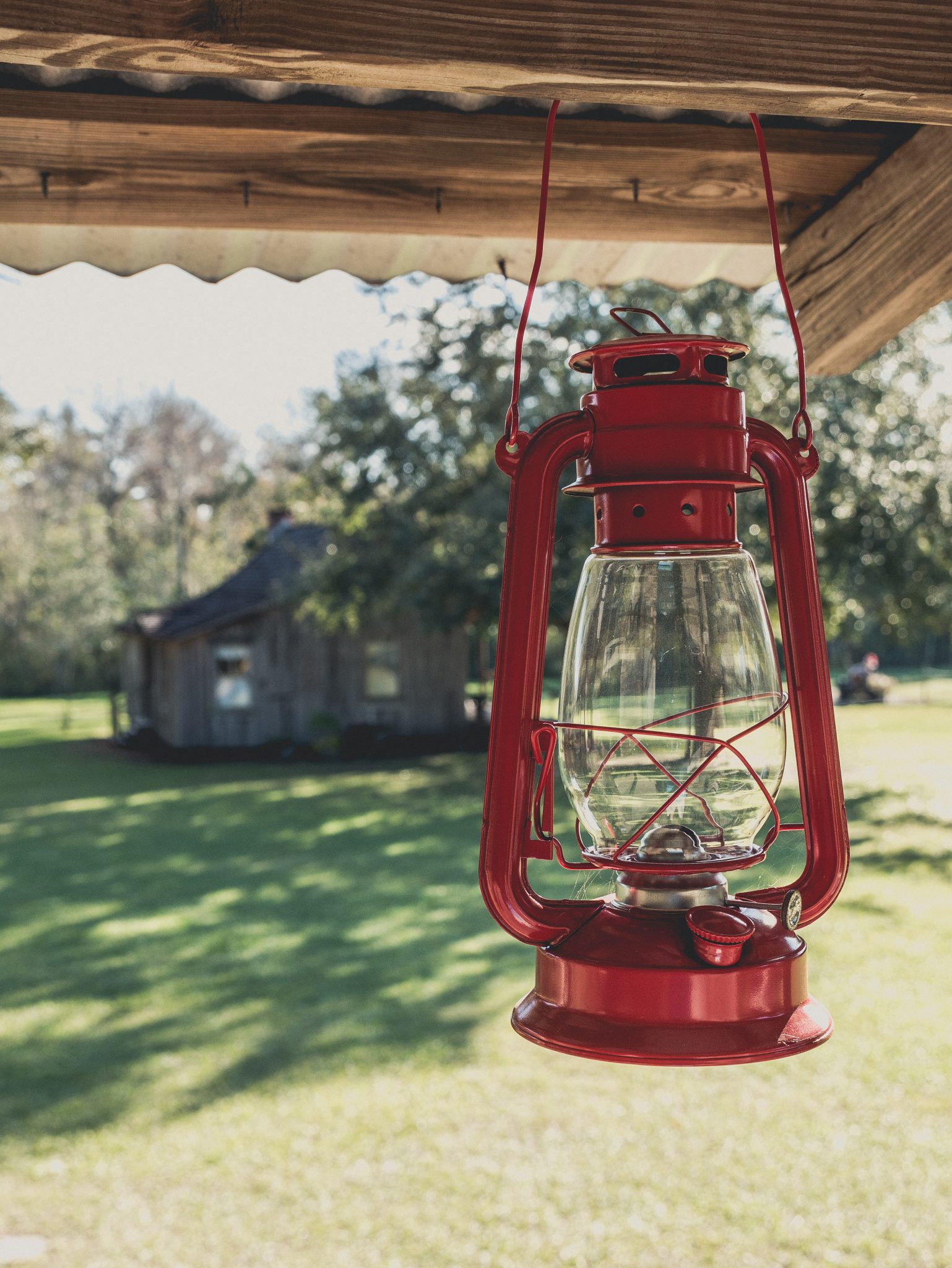 Red lantern hanging from an old historic home in Christmas, Florida.
