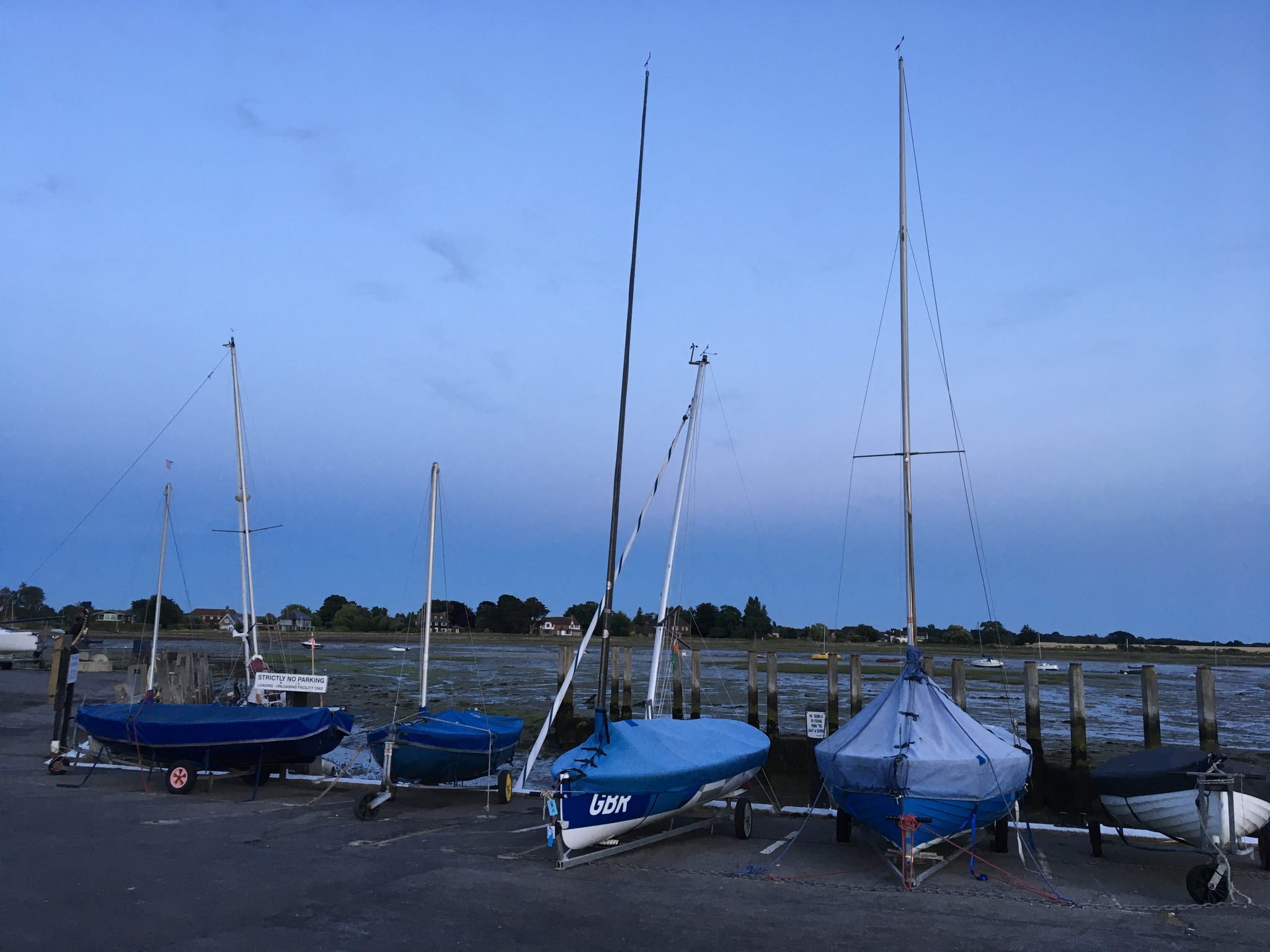 Sailing boats "resting" on dry land after a day in the water.