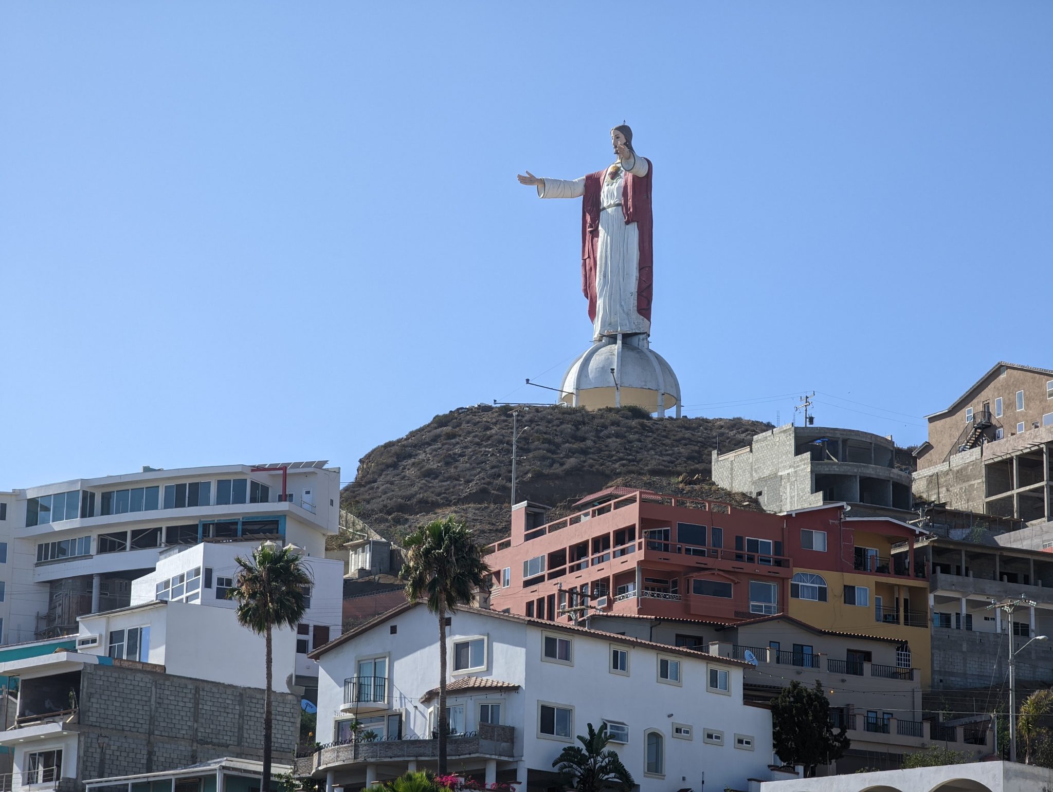 Christo del Sagrado Corazón (Christ of the Sacred Heart) statue and hillside in villa San Pedro, Mexico