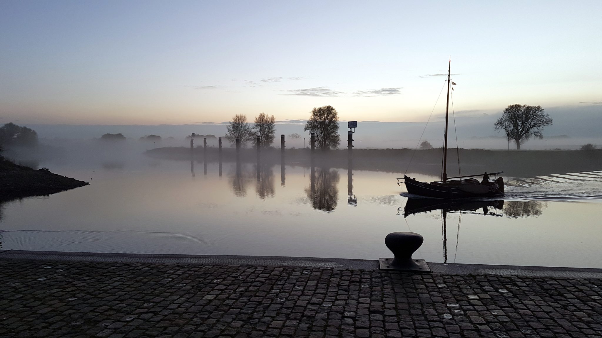 Misty quay on the IJssel, IJsselkade, Doesburg, the Netherlands
