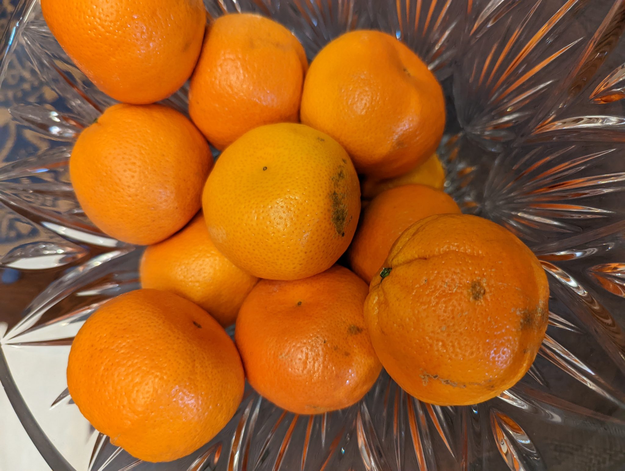 A bowel of small oranges.