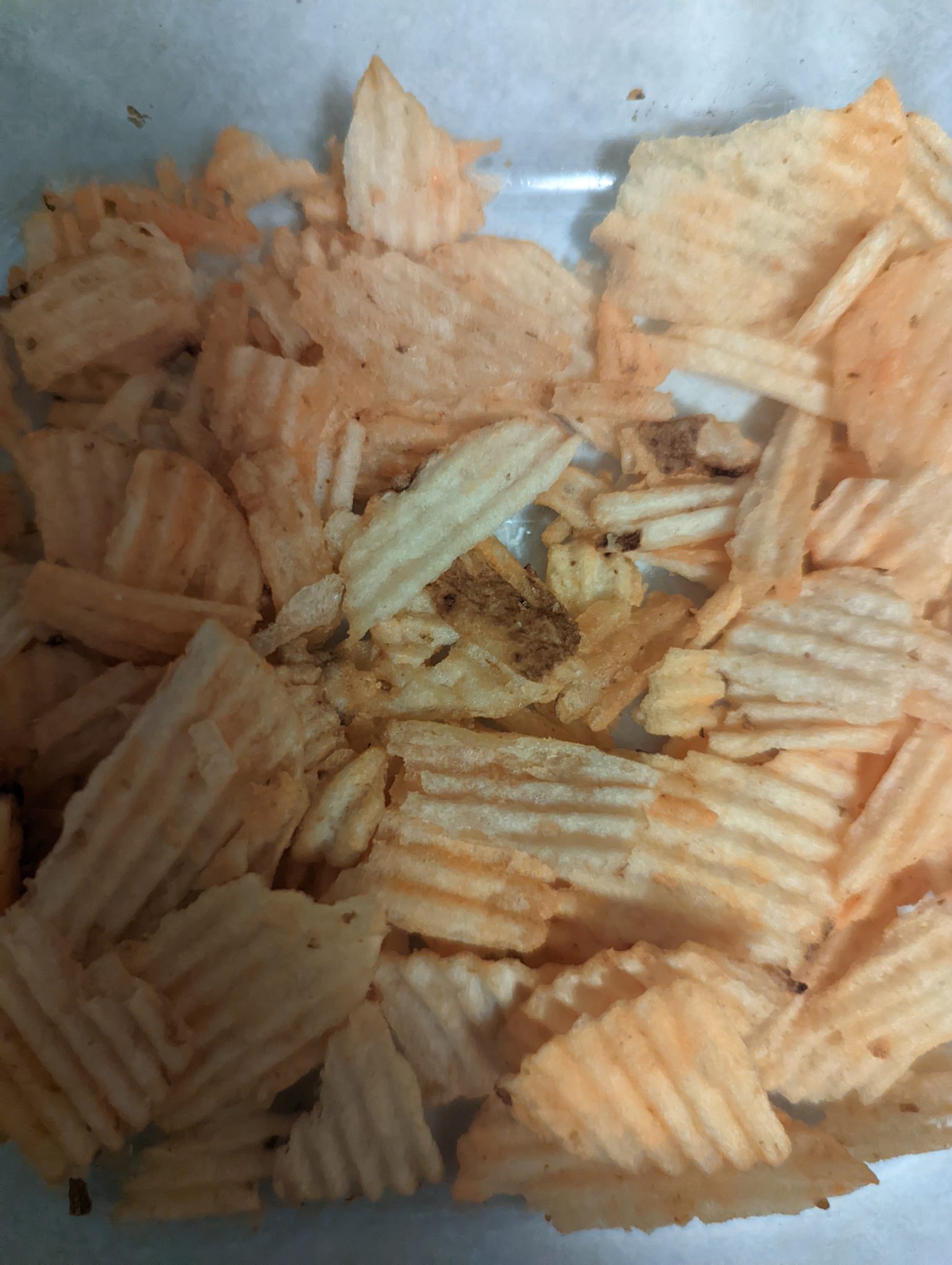Close up of some potato chips. The chips have ridges.