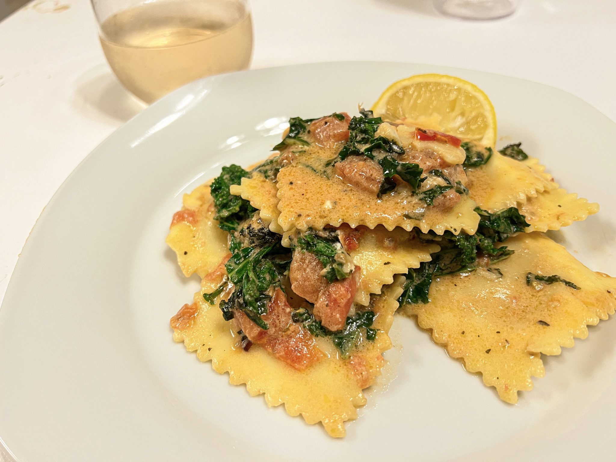 Ravioli with kale and tomatoes