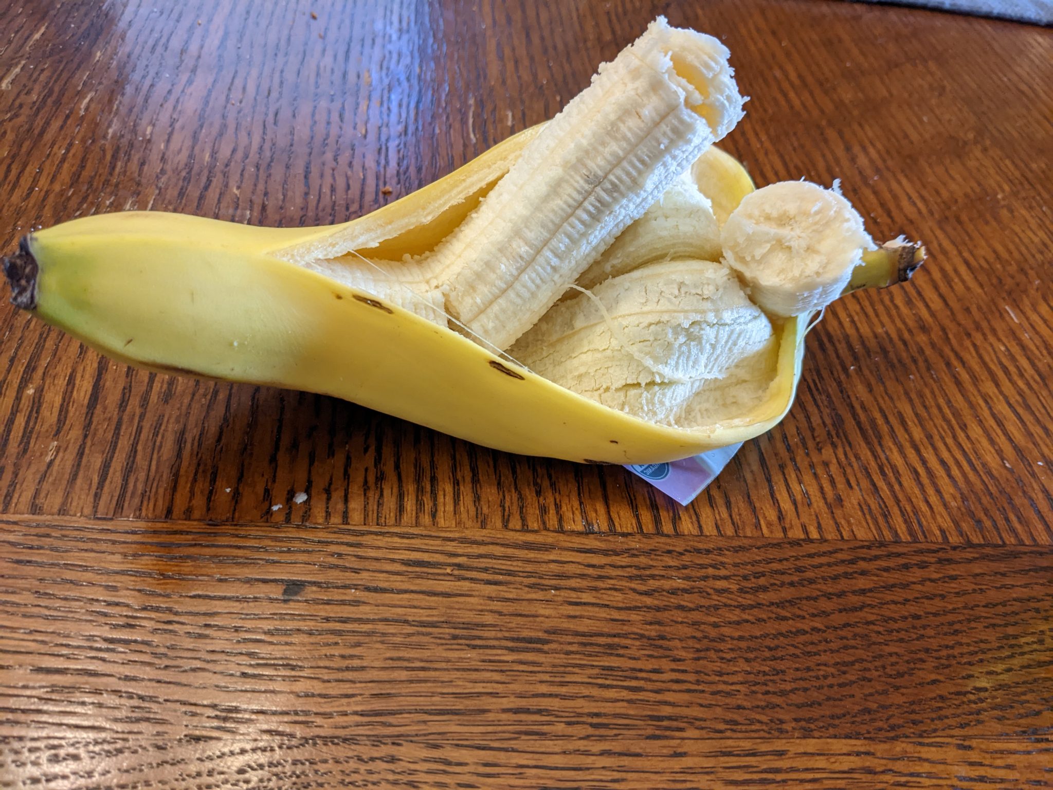 An open banana on a table