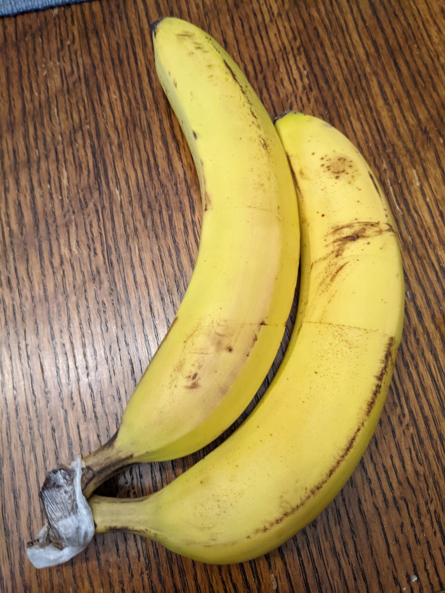 Two bananas on a table