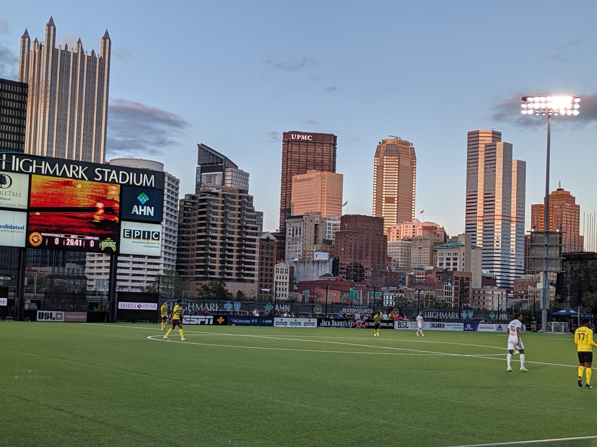 Pittsburgh skyline behind a soccer field