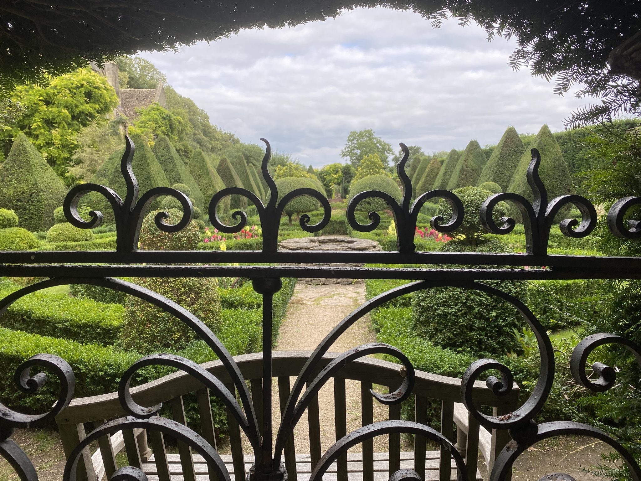 Wrought iron railing with rococo garden beyond
