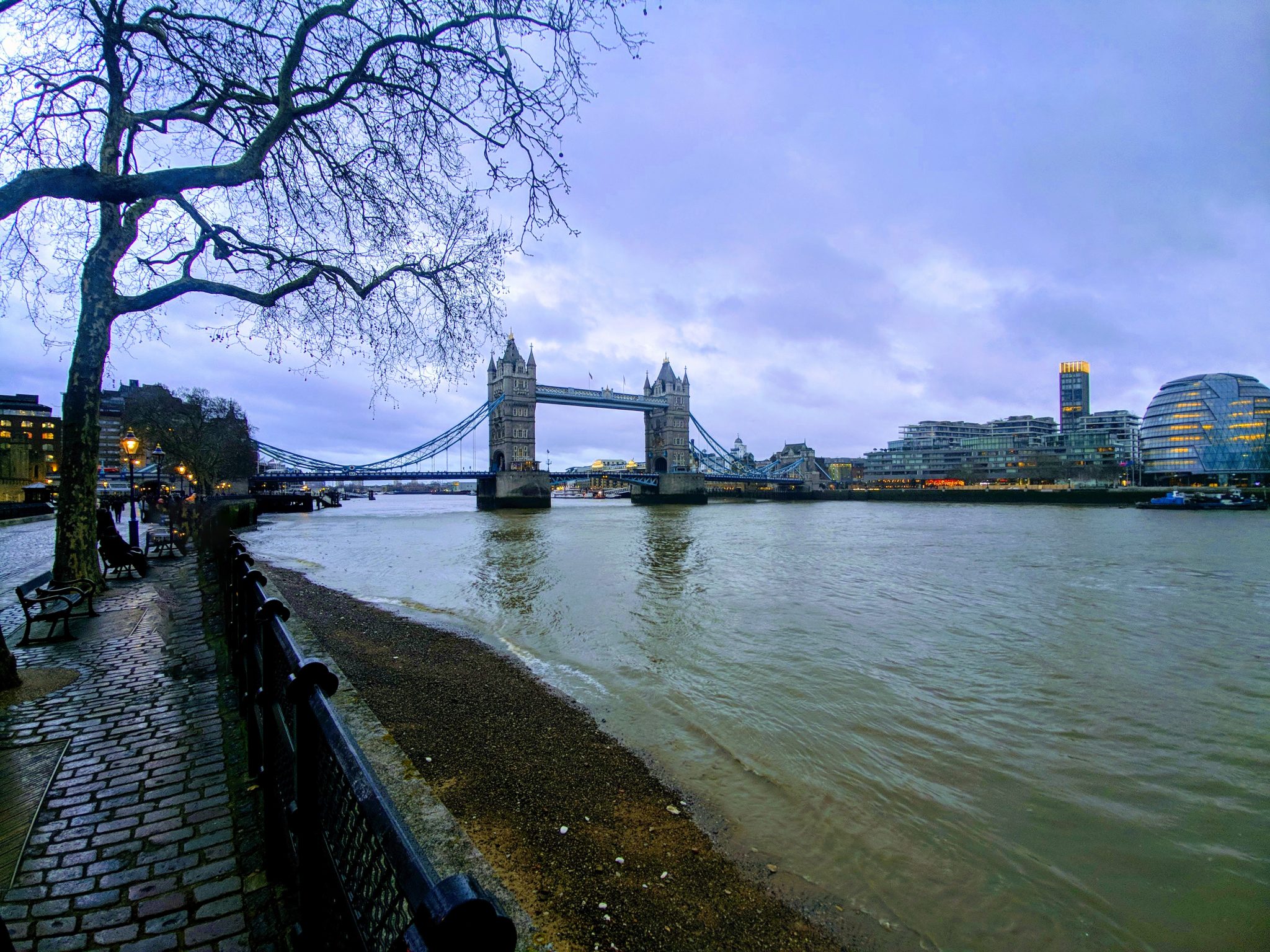 Tower Bridge and the Thames River at dusk in London, UK