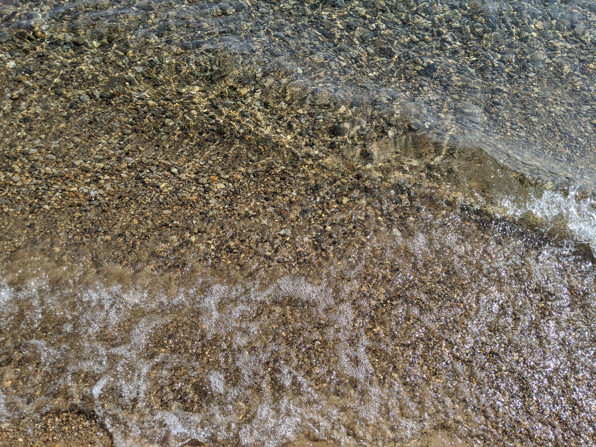 Rocks under waves on the shore of Lake Michigan