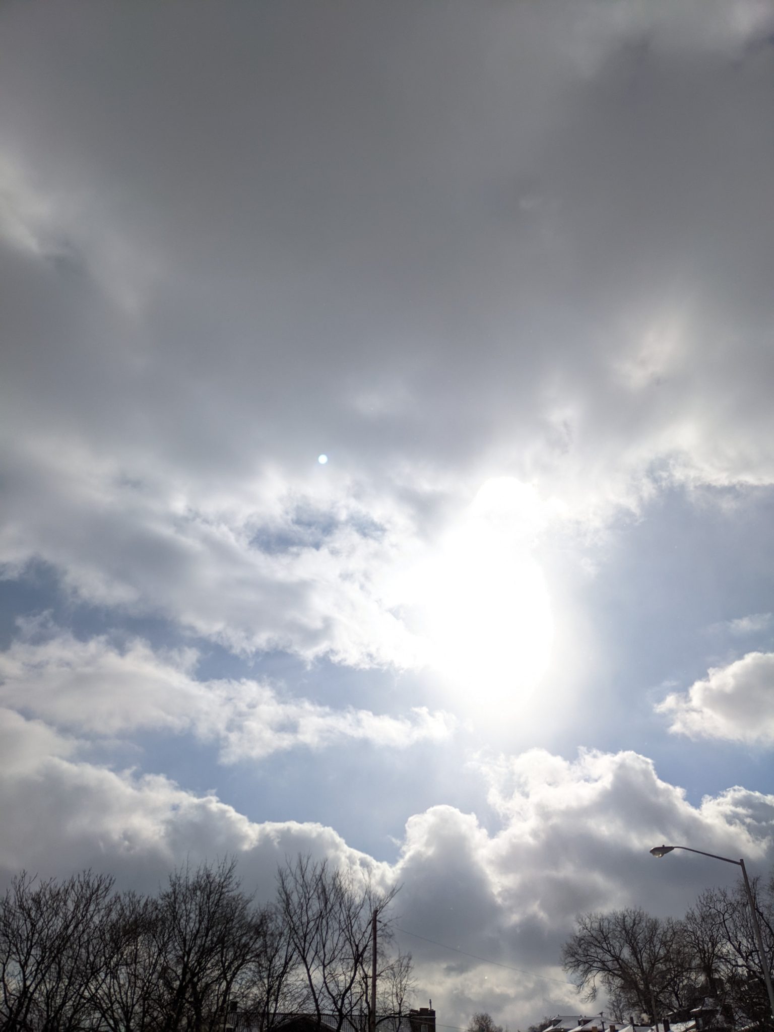 This sun shining through the clouds