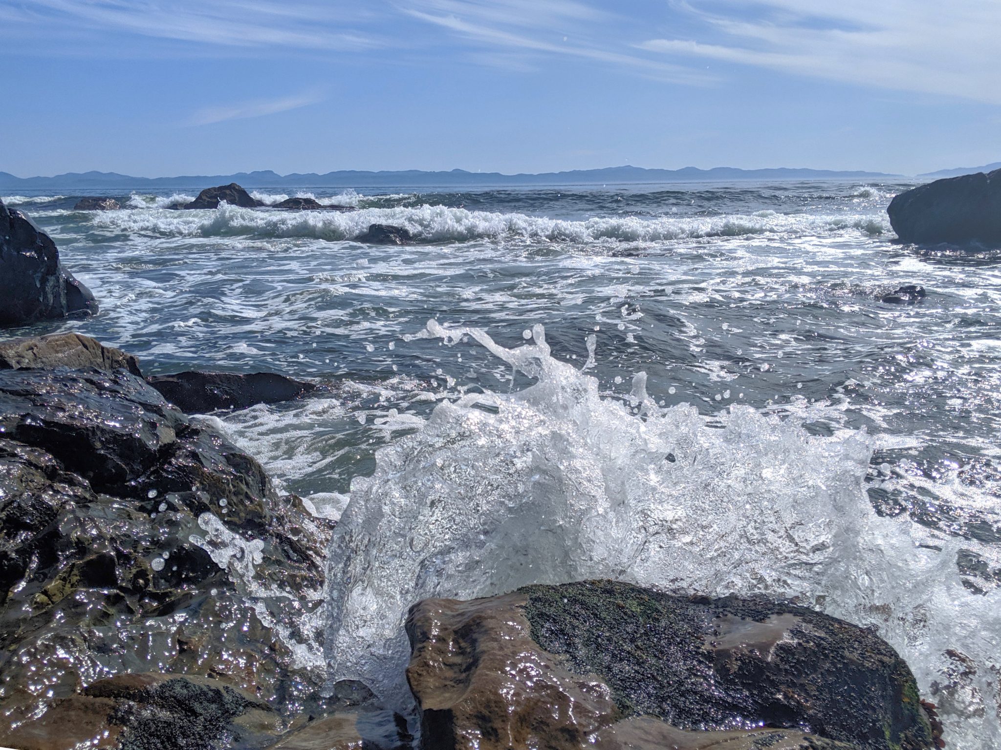 Ocean waves breaking on rocks on Vancouver Island in British Columbia Canada