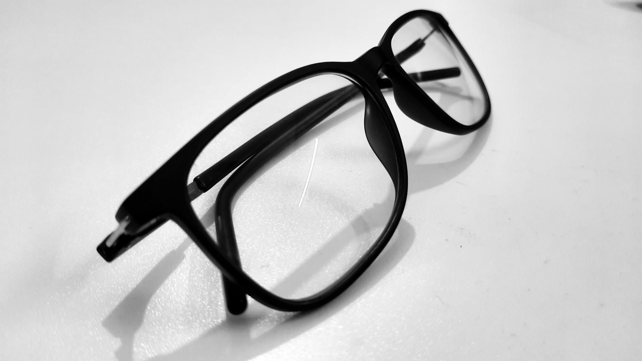 Eyeglasses on a white table