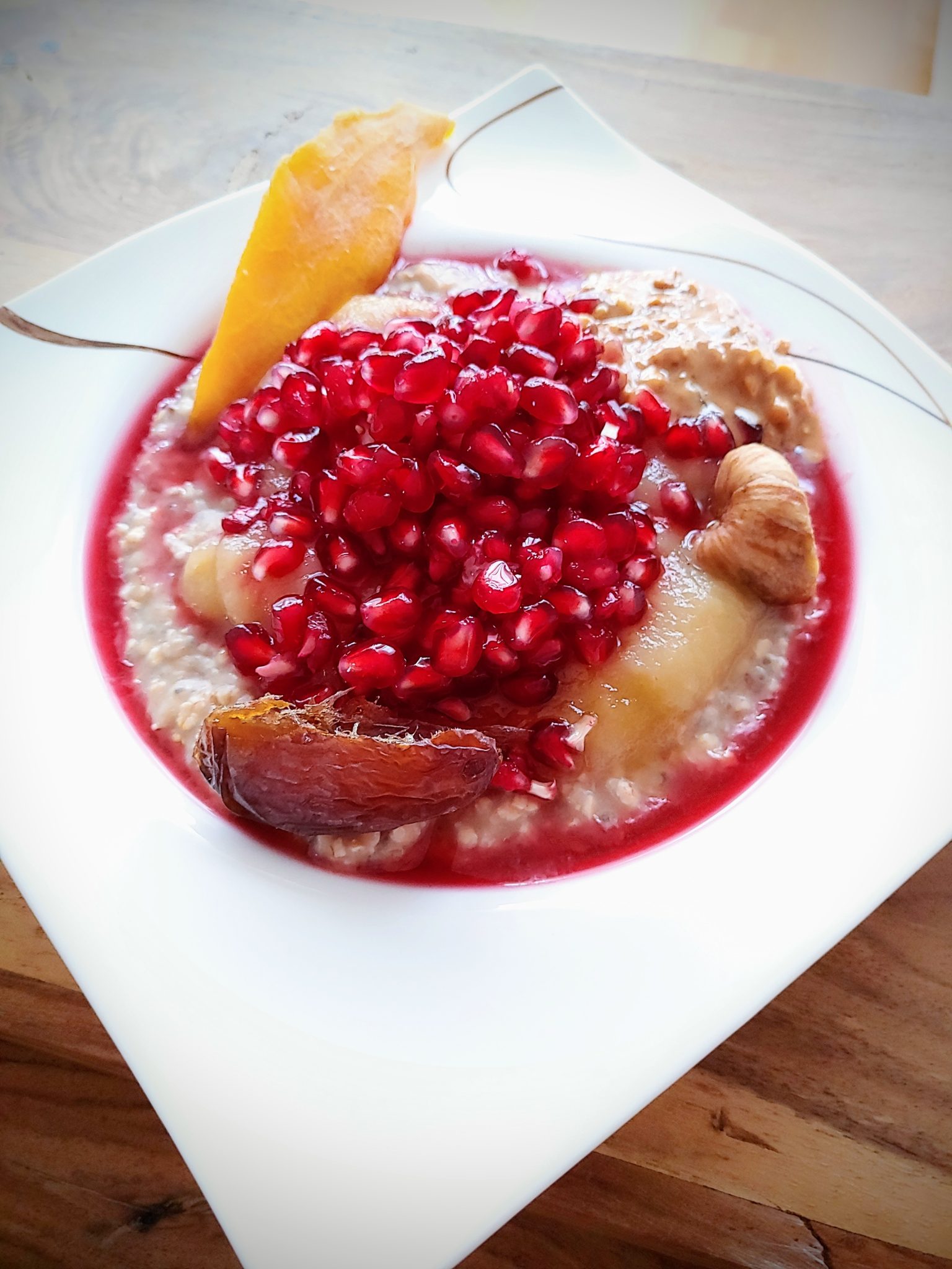 Porridge topped with pomegranate.