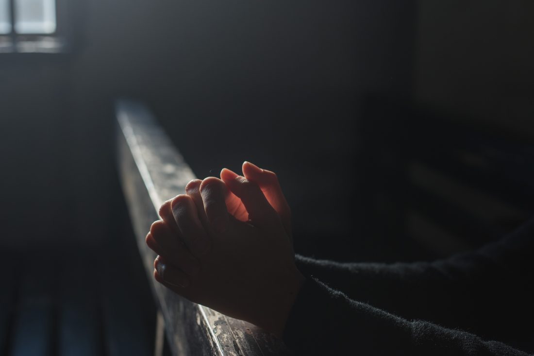 Hands Praying in Church