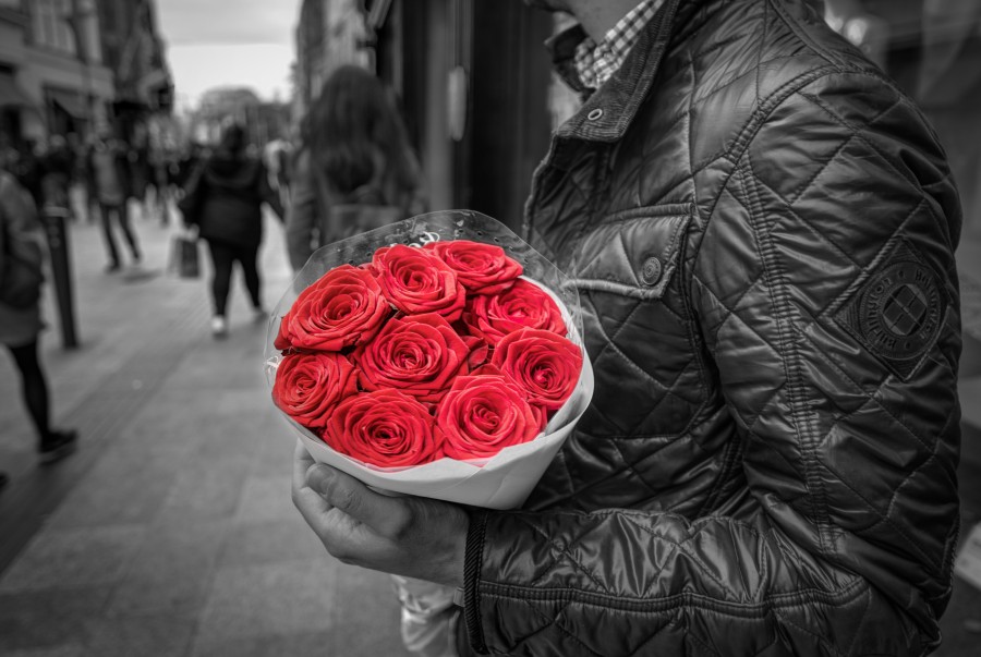 Holding red roses
