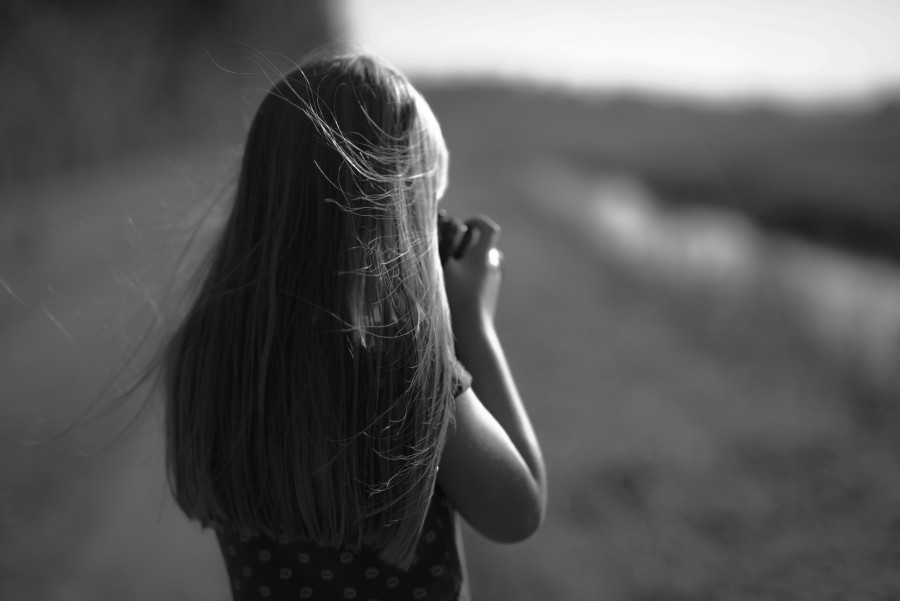 Girl taking picture in black and white