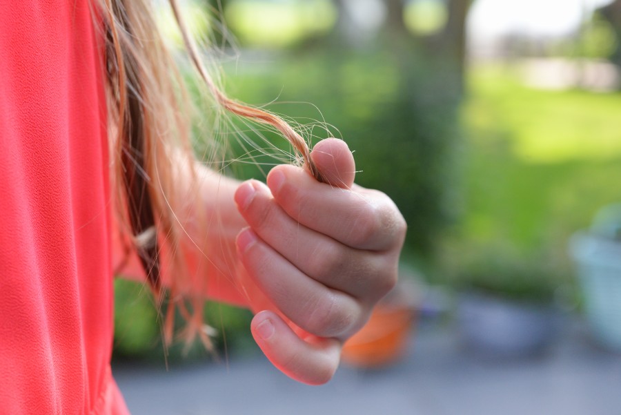 Girl playing with tangled hair