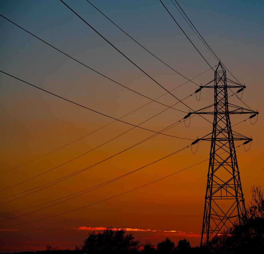 Electricity pylon against a spring sunset