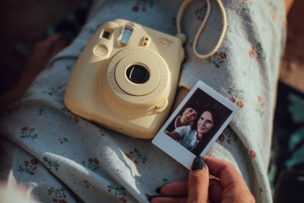 Woman Polaroid Camera