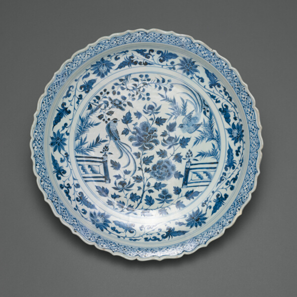 Shallow Dish with Long-Tailed Birds in a Garden of Stylized Peonies and Fronds, Encircled by a Scrolling Wreath of Camellia and Lotus Blossoms