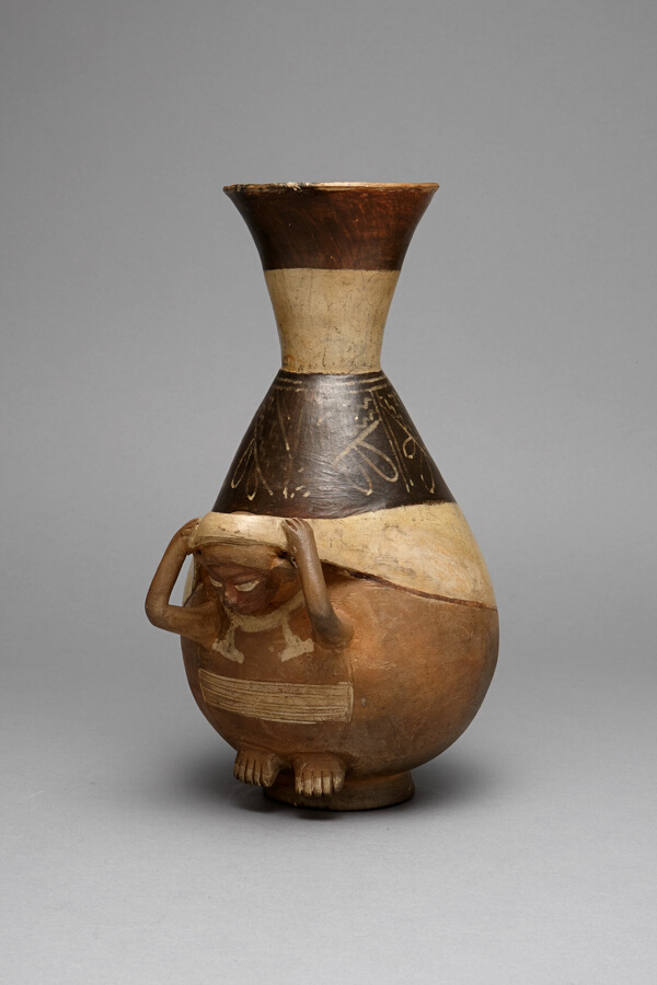 Bottle in Form of a Figure Carrying a Burden with a Tumpline