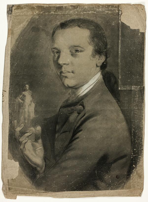 Young Man Holding Statuette