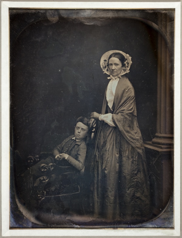 Untitled (A Woman in Bonnet and Shawl, with her Seated Son)