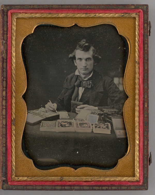 Untitled (Portrait of Seated Man Holding a Daguerreotype and Brush)