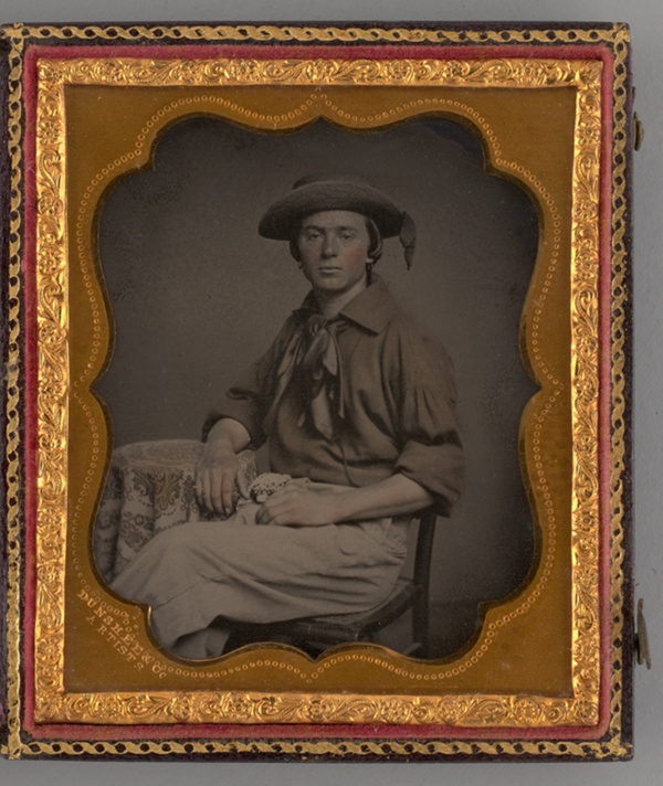 Untitled (Portrait of Seated Man Wearing Straw Hat)