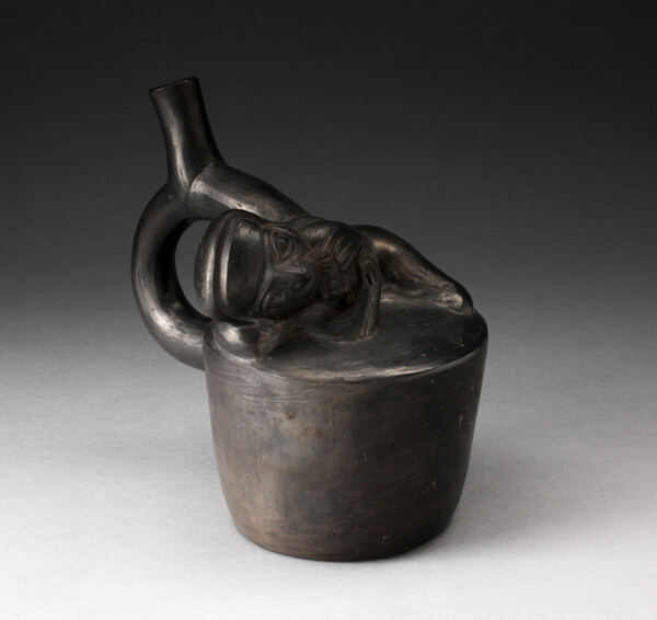 Blackware Handle Spout Vessel with Relief of a Reclining Musician with Pipes