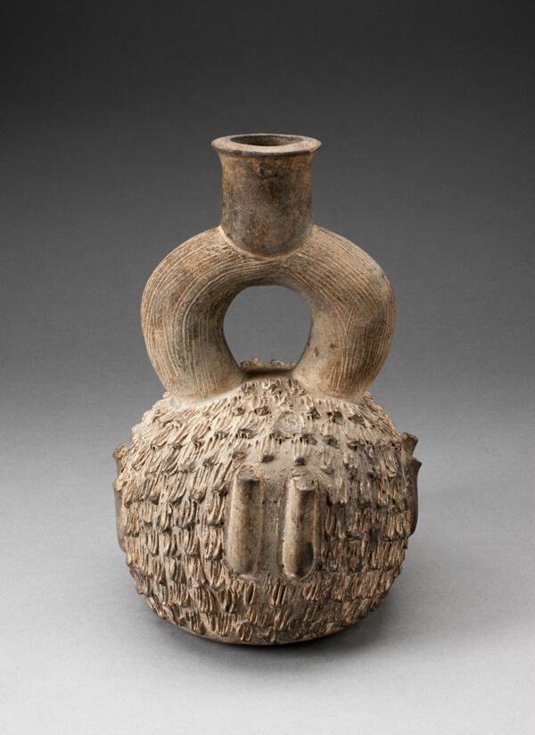 Stirrup Spout Vessel with Raised Appliques Covering the Surface
