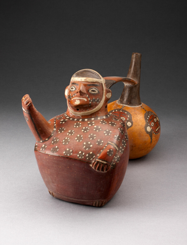 Double-Chambered Vessel Depicting a Figure and Trophy Heads