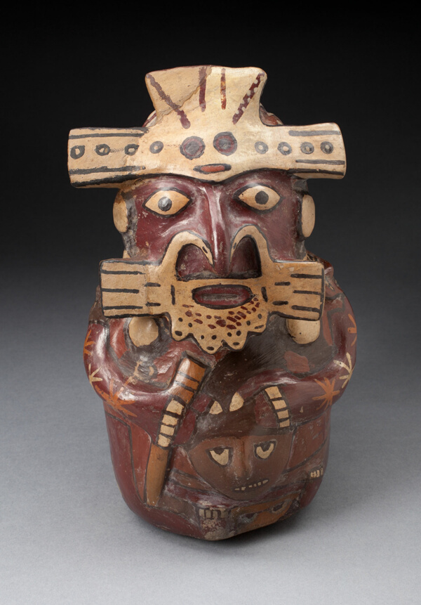 Single Spout Vessel in the Form of a Seated Figure Wearing Mask and Headdress, Holding a Trophy Head