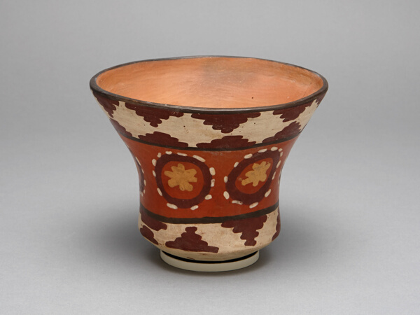 Cup Depicting Repeated Flower-Like Motifs